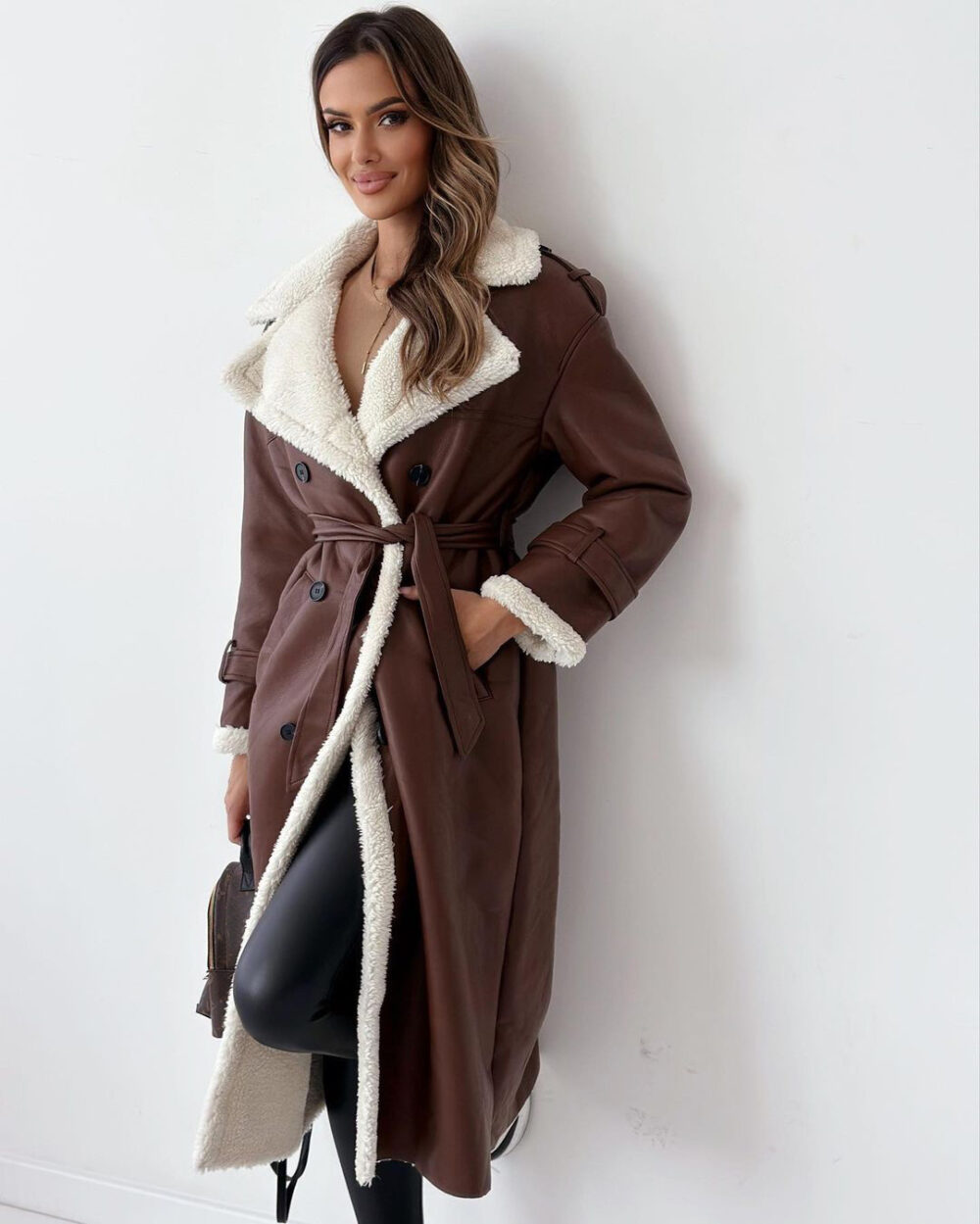 Elevate your style with this elegant, belted, long trench